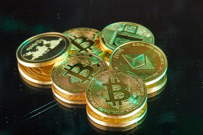 bunch-of-golden-bitcoins-and-ethereum-coins-close-2022-01-29-21-43-19-utc.jpg